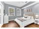 Bright bedroom featuring hardwood floors, a double window, neutral paint, and simple decor at 1943 Wingfield Dr, Longwood, FL 32779