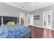 This bedroom features hardwood floors, ensuite bathroom, and walk-in closet at 1943 Wingfield Dr, Longwood, FL 32779