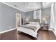 Bedroom featuring hardwood floors, a double window, neutral paint, ceiling fan and simple decor at 1943 Wingfield Dr, Longwood, FL 32779