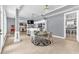 Open floorplan includes a dining area with a chandelier, and views of the living area and bar at 1943 Wingfield Dr, Longwood, FL 32779