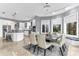 Dining room with bay windows, modern chandelier, views of the outdoors, and easy access to the kitchen at 1943 Wingfield Dr, Longwood, FL 32779