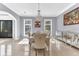 Bright dining room with chandelier lighting, and a mirrored sideboard for elegant dining at 1943 Wingfield Dr, Longwood, FL 32779