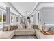 Open concept living area features a large comfortable sectional sofa, neutral decor, and plenty of natural light at 1943 Wingfield Dr, Longwood, FL 32779