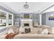 Inviting living room with fireplace, stylish decor and lots of natural light at 1943 Wingfield Dr, Longwood, FL 32779