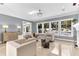 Bright living room featuring a fireplace, modern furniture, and views of the pool at 1943 Wingfield Dr, Longwood, FL 32779