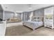 Spacious main bedroom features neutral decor, plush carpet, and plenty of natural light at 1943 Wingfield Dr, Longwood, FL 32779