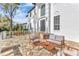 Spacious stone patio features comfortable seating and manicured hedges overlooking the property at 1943 Wingfield Dr, Longwood, FL 32779