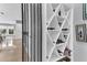 Secured wine cellar with a custom geometric wine rack and beverage storage at 1943 Wingfield Dr, Longwood, FL 32779