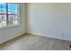 Neutral bedroom with tile flooring and a large window offering lots of natural light at 1988 Iorio Dr, St Cloud, FL 34771