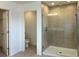 Modern bathroom featuring a glass shower and a separate toilet room at 2036 Iorio Dr, St Cloud, FL 34771