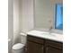 Bathroom with vanity, faucet, toilet and a decorative mirror at 2036 Iorio Dr, St Cloud, FL 34771