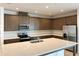 Beautiful kitchen features stainless steel appliances, granite countertops, and lots of storage at 2036 Iorio Dr, St Cloud, FL 34771