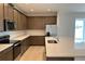 Modern kitchen showcases granite countertops, sleek stainless steel appliances, and a breakfast bar at 2036 Iorio Dr, St Cloud, FL 34771
