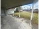 Covered patio that overlooks a private, grassy backyard with a fenced boundary at 204 W Cottesmore Cir, Longwood, FL 32779