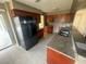 A spacious kitchen is equipped with stainless steel appliances and ample cabinet space at 204 W Cottesmore Cir, Longwood, FL 32779