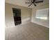 The Living room features tile floors and a ceiling fan at 204 W Cottesmore Cir, Longwood, FL 32779
