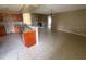 A spacious kitchen and living room boast tile floors at 204 W Cottesmore Cir, Longwood, FL 32779
