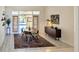 Well-lit dining room featuring modern furnishings and sliding door access to the screened lanai at 2606 Woodwind Hills Ln, Lakeland, FL 33812