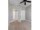 Bedroom with neutral paint, carpet, a double door closet, and access to the hallway and bathroom at 2808 Osprey Cove Pl # 202, Kissimmee, FL 34746