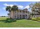 Inviting two-story home with a beautifully landscaped lawn, mature trees, and private stairwell leading to the 2nd story at 2808 Osprey Cove Pl # 202, Kissimmee, FL 34746