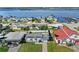 Breathtaking aerial view showcasing the neighborhood's proximity to the serene waterfront and marina at 3226 S Peninsula Dr, Daytona Beach Shores, FL 32118
