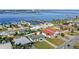 An aerial view of single-story home showcasing its waterfront location and neighborhood at 3226 S Peninsula Dr, Daytona Beach Shores, FL 32118