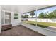 Screened in lanai boasts tile flooring and an open view of the fenced backyard at 3226 S Peninsula Dr, Daytona Beach Shores, FL 32118
