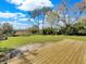 Expansive backyard featuring a new wooden deck perfect for outdoor entertaining and relaxation at 4112 Grove Pl, Lakeland, FL 33810