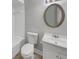 Clean bathroom with tub, toilet, and vanity, featuring a neutral color scheme at 4112 Grove Pl, Lakeland, FL 33810