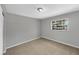 Cozy bedroom with carpeted floors and a bright window at 4112 Grove Pl, Lakeland, FL 33810
