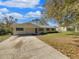 Charming single-story home featuring blue shutters and a well-maintained front yard at 4112 Grove Pl, Lakeland, FL 33810