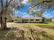 Charming single-story home featuring blue shutters and a well-maintained front yard at 4112 Grove Pl, Lakeland, FL 33810