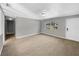 Bright living room with carpeted floors and a view to the front yard at 4112 Grove Pl, Lakeland, FL 33810