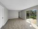 Living room with sliding glass doors to a deck and a view of the backyard at 4112 Grove Pl, Lakeland, FL 33810