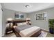 Cozy bedroom with a decorative headboard, accent lighting, and a calming color scheme at 4112 Grove Pl, Lakeland, FL 33810