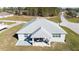 Aerial view of home showcasing the roof, rear patio, and surrounding landscape at 4590 Sw 99Th St, Ocala, FL 34476