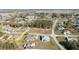 The aerial view displays the home's generous yard space, complemented by mature trees and a neighborhood setting at 4590 Sw 99Th St, Ocala, FL 34476