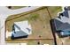 An aerial shot shows the backyard area and property line, the house, and its proximity to neighbors with pools at 4590 Sw 99Th St, Ocala, FL 34476