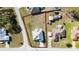 An overhead shot displaying the home's lush surroundings, expansive yard, and proximity to the local street at 4590 Sw 99Th St, Ocala, FL 34476