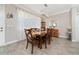 Cozy dining area illuminated by a modern chandelier, perfect for Gathering meals and entertaining at 4590 Sw 99Th St, Ocala, FL 34476