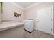 Functional laundry room with modern appliances and ample counter space for sorting and folding at 4590 Sw 99Th St, Ocala, FL 34476
