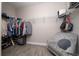 Spacious walk-in closet with shelving and hanging rods, plus a comfortable seating area at 4590 Sw 99Th St, Ocala, FL 34476