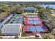 An aerial shot of community tennis courts, clubhouse, and parking lot at 4721 Tara View Road, Leesburg, FL 34748