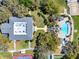 Aerial view of the community pool, tennis courts, and clubhouse at 4721 Tara View Road, Leesburg, FL 34748