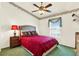 Comfortable bedroom featuring plush carpet, ceiling fan and a bright window at 4721 Tara View Road, Leesburg, FL 34748