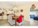 Bright dining room with chandelier, tile floors, and open access to kitchen and living area at 4721 Tara View Road, Leesburg, FL 34748