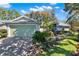 Charming single Gathering home featuring a landscaped front yard and attached two car garage at 4721 Tara View Road, Leesburg, FL 34748