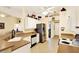 Bright kitchen featuring white cabinets, stainless steel appliances, and tile flooring at 4721 Tara View Road, Leesburg, FL 34748