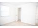 Bedroom featuring light tile flooring, bright windows, closet, and white trim at 4840 Transport Rd, Bartow, FL 33830