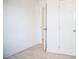 White bedroom with tile flooring, white trim, and doors leading to additional spaces and a closet at 4840 Transport Rd, Bartow, FL 33830